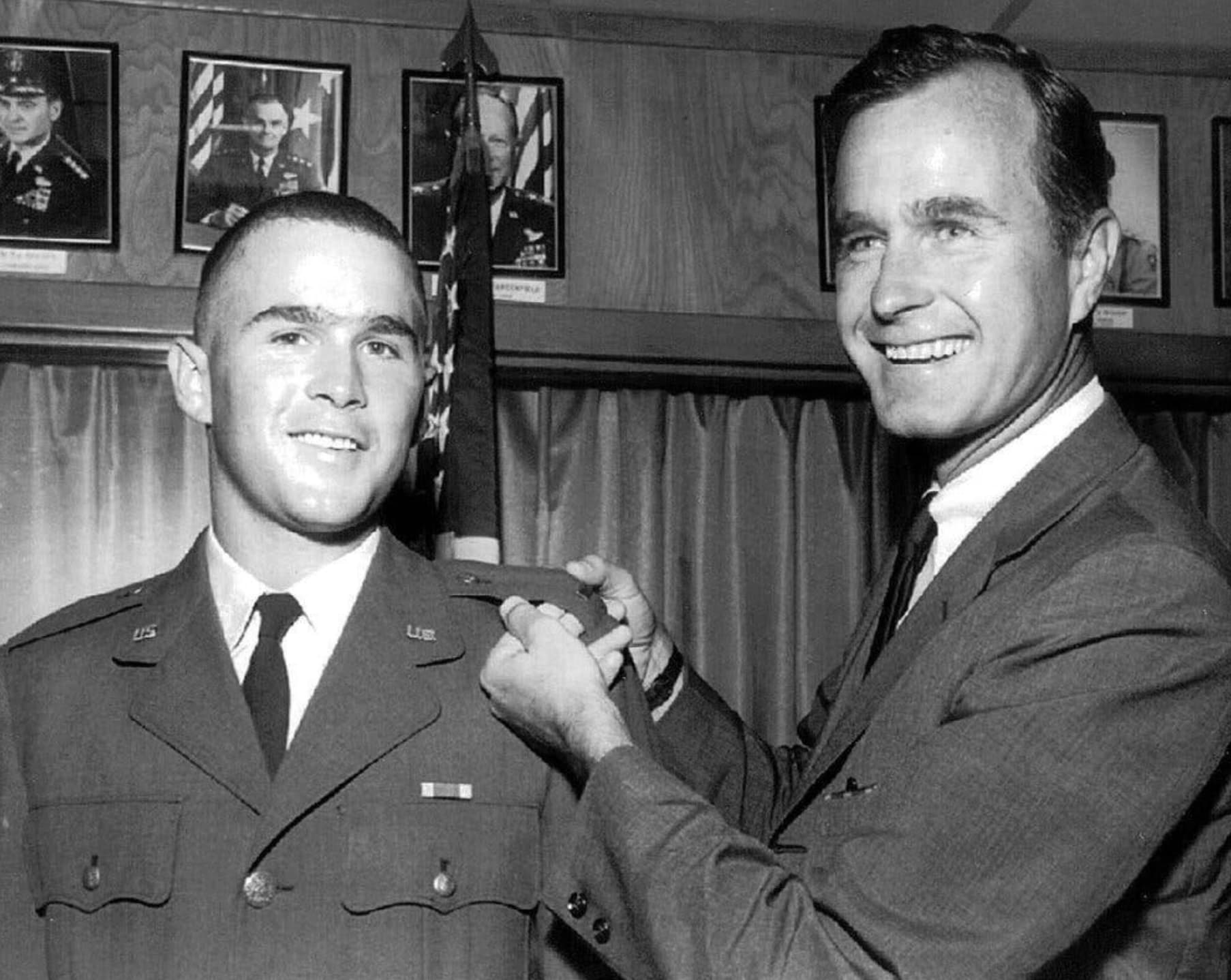 “George H. W. Bush displays his son George W. Bush's officer bar on his Texas Air National Guard uniform 1968.”